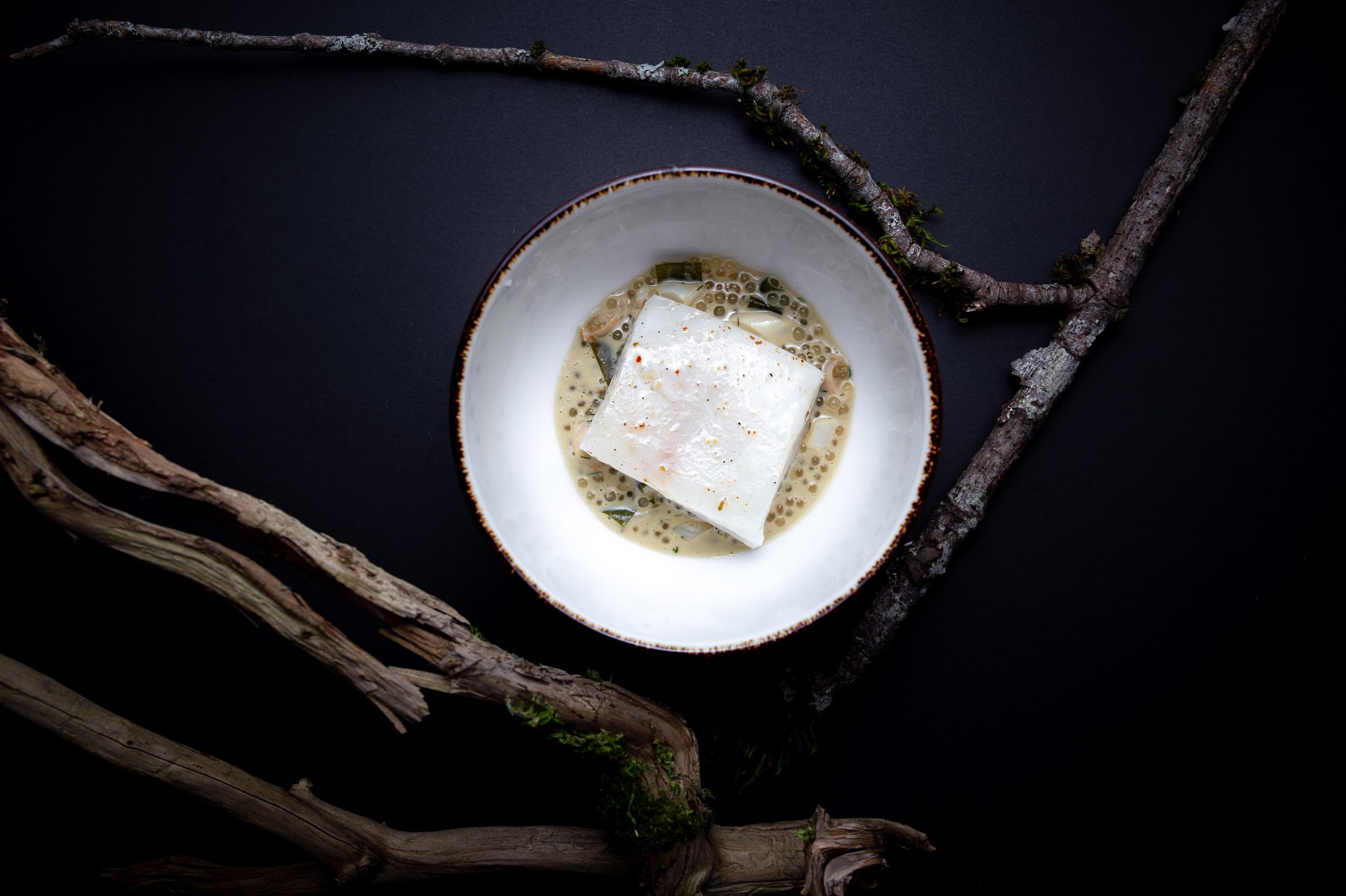A plated halibut dish for a TableOne dinner