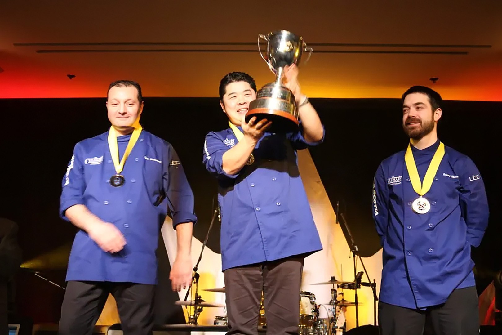 Chef Alex Chen raising the trophy after winning the Canadian Culinary Championship