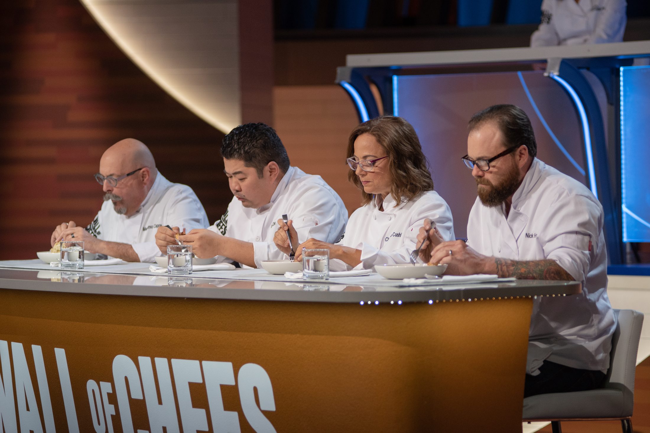 Chef Alex Chen judging alongside fellow chefs on Wall of Chefs