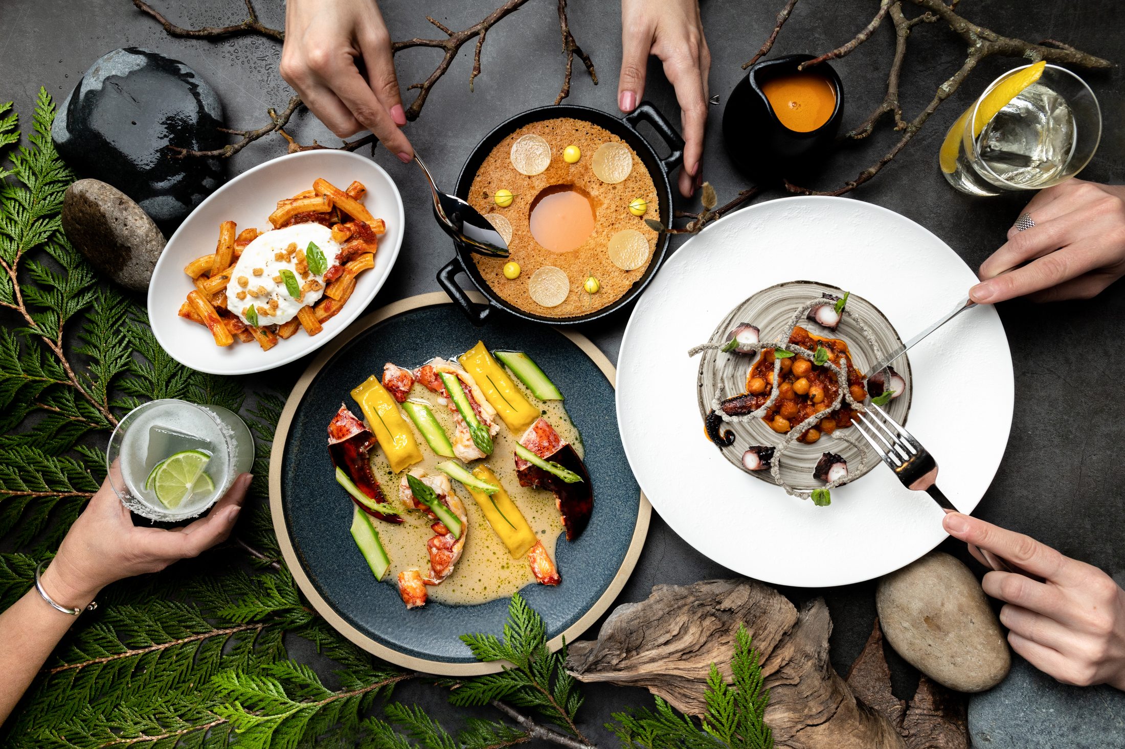 A spread of dishes from Wild Blue Restaurant + Cocktail Bar in Whistler